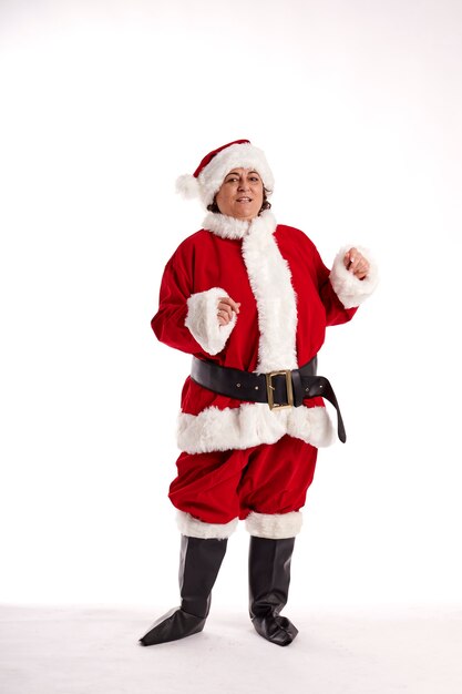 A middle-aged woman in a Santa Claus costume with a white background