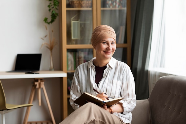 Photo middle aged woman with skin cancer spending time at home