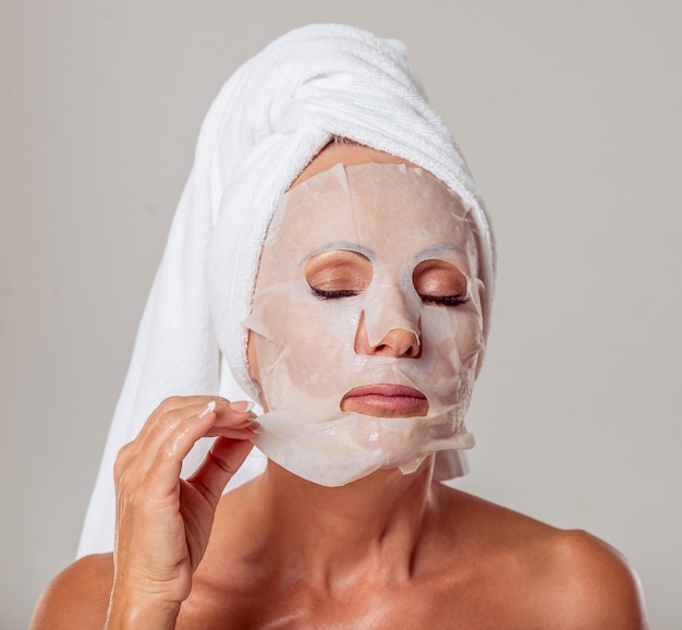 middle aged woman with a towel on her head