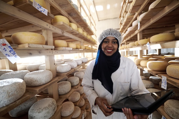 middle eastern black african muslim female business woman team in local  cow and goat milk cheese food production company