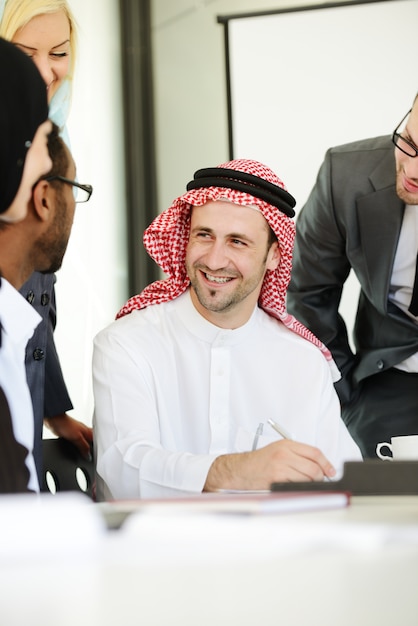 Middle eastern business people working together in modern office