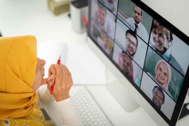 Middle Eastern businesswoman having online conference at home