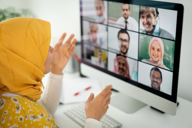 Middle Eastern businesswoman having online conference at home