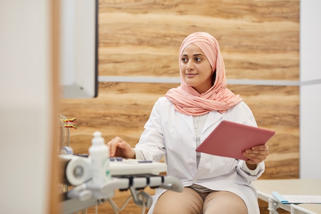 Middle-Eastern Doctor Working in Clinic