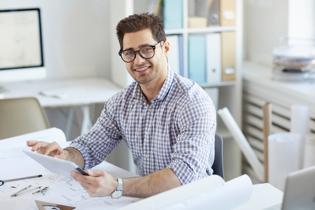 Middle-Eastern Engineer Using Digital Tablet