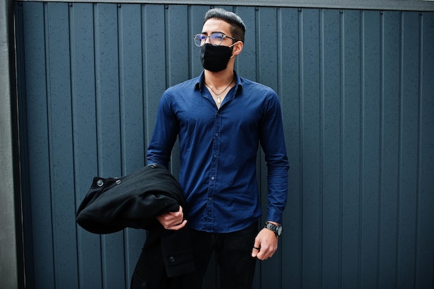 Middle eastern entrepreneur wear black face mask and eyeglasses New normal life after coronavirus pandemia