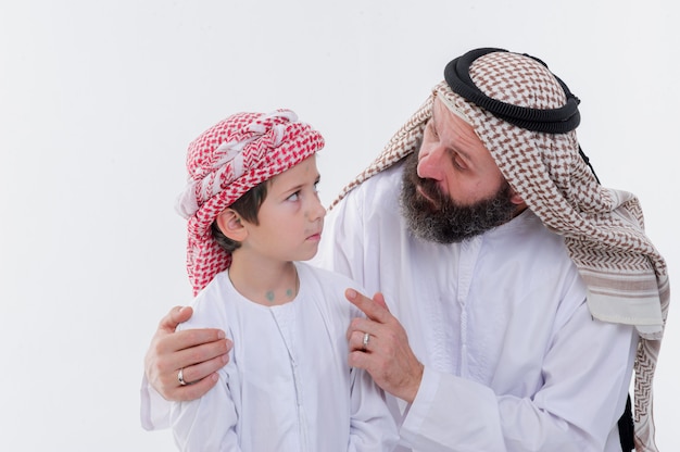 Middle eastern father teaching his son