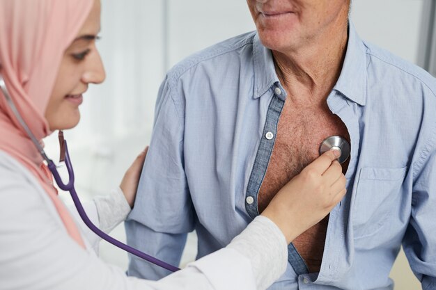 Middle-Eastern Female Doctor Checking Patient