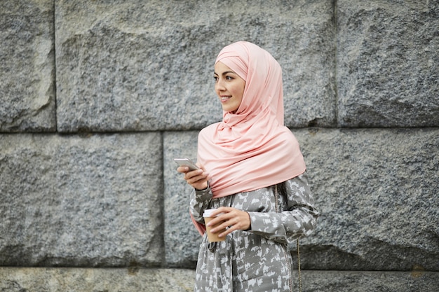 Middle eastern lady with gadget