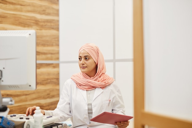 Middle-Eastern Nurse Working in Clinic