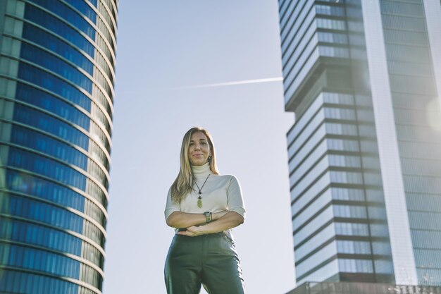 middleaged business woman with folded arms and copy space for text