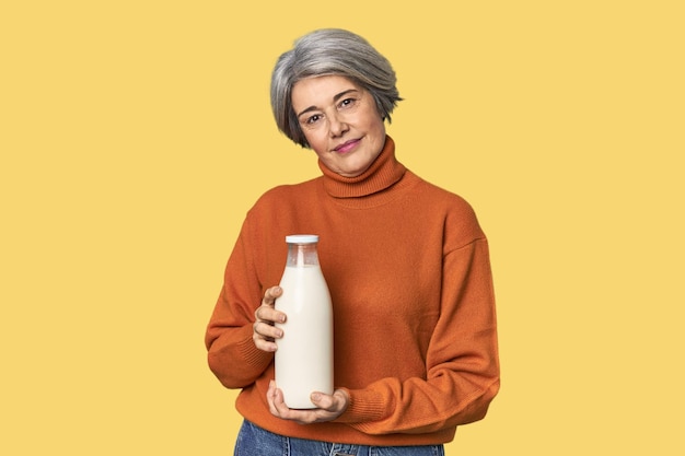 Middleaged Caucasian woman with milk bottle