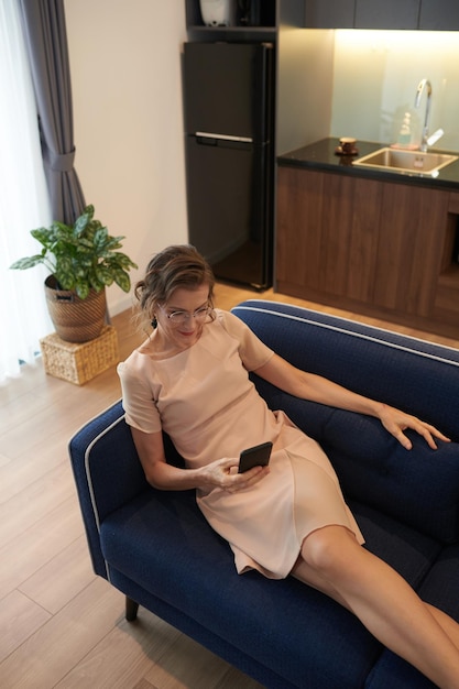 Middleaged Woman Resting on Couch