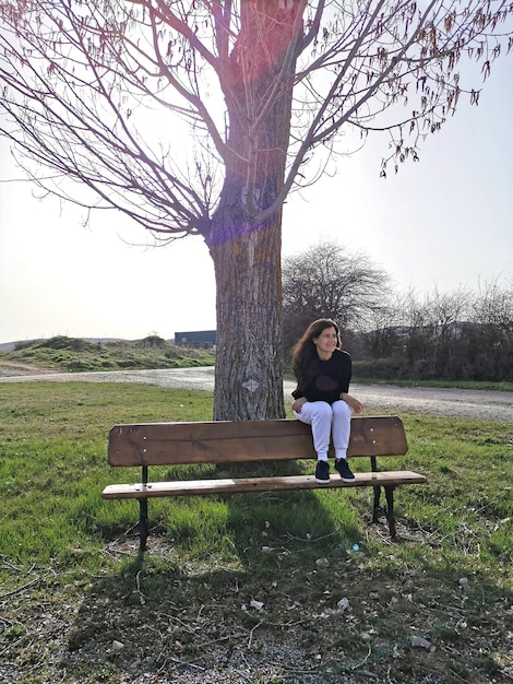 Middleaged woman sitting enjoying the weather and the outdoors