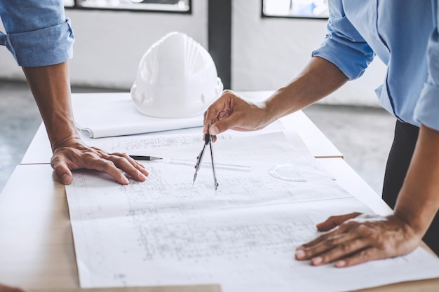 Photo midsection of architects working in office