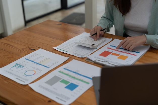 midsection of business colleagues working on table