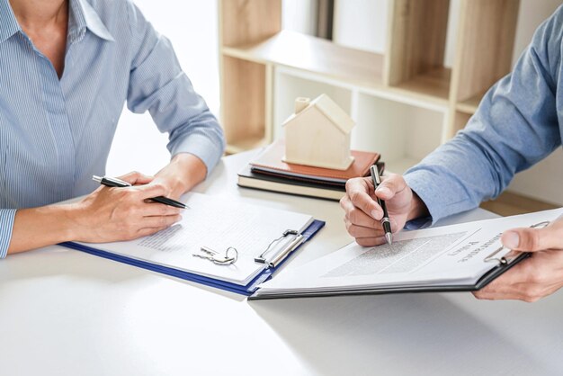 Midsection of business colleagues working on table