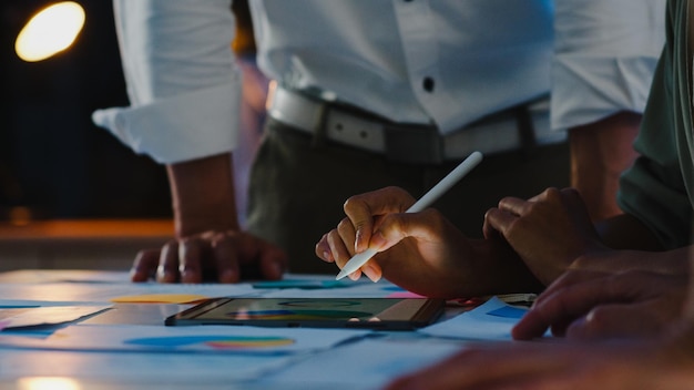 Photo midsection of business people working at table