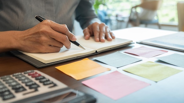 Midsection of business person working in office