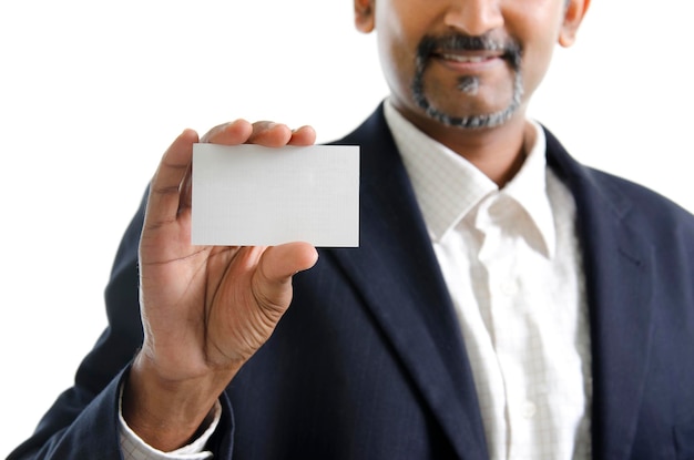Photo midsection of businessman holding blank visiting card against white background