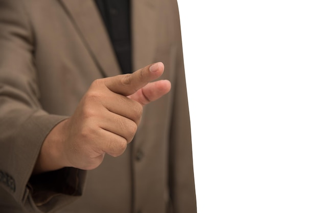 midsection of businessman pointing while standing against white background
