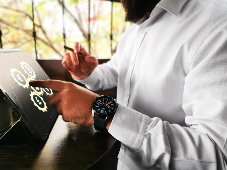 Photo midsection of businessman using digital tablet on desk