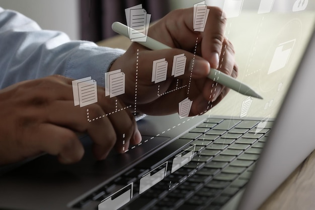 Photo midsection of businessman using laptop