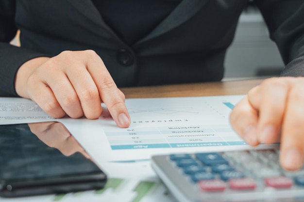 Midsection of businessman working at desk in office