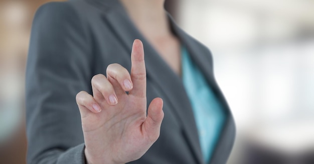 Midsection of businesswoman touching futuristic screen