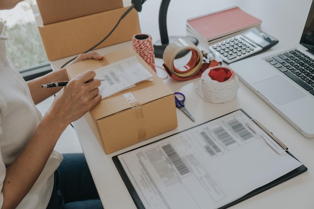 midsection of businesswoman working on table
