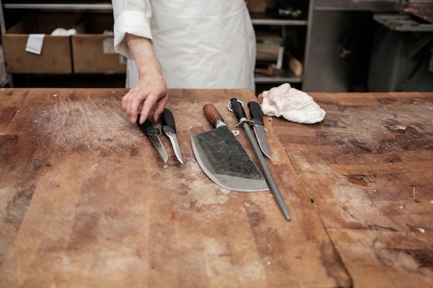 Photo midsection of butcher in shop