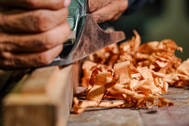 Midsection of carpenter working on wood