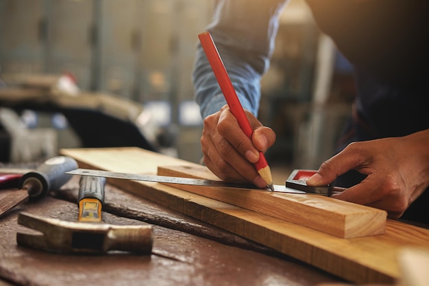 midsection of carpenter working in workshop