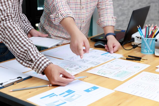 midsection of colleagues working in office