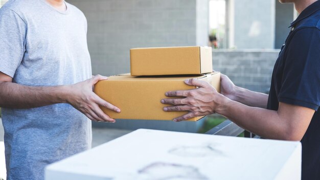 Midsection of couple holding camera in box