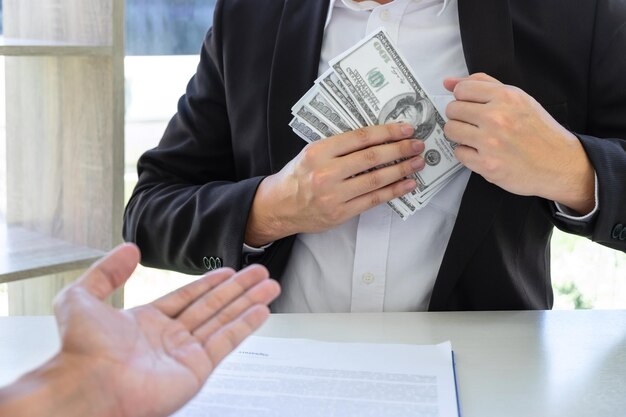 Photo midsection of customer and agent having business on table