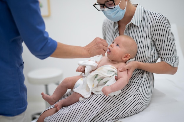 midsection of doctor examining patient