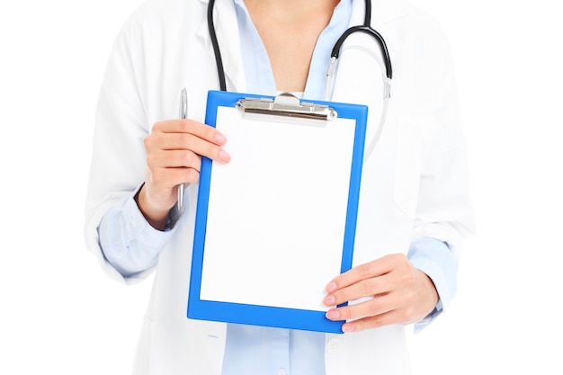 A midsection of doctor holding documents over white background