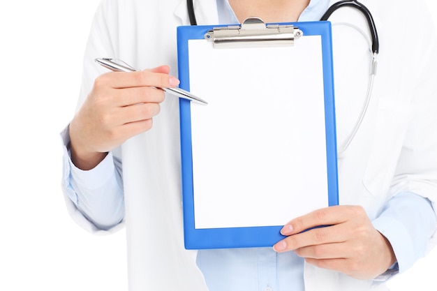 Photo a midsection of a doctor holding files over white background