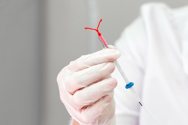 Photo midsection of doctor holding syringe