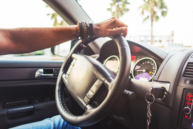 Photo midsection of man driving car