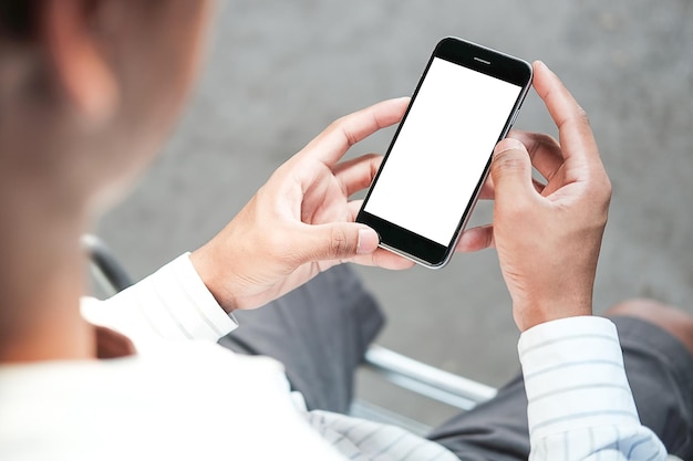 Photo midsection of man holding blank mobile phone