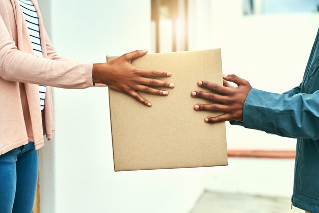 Midsection of man holding box