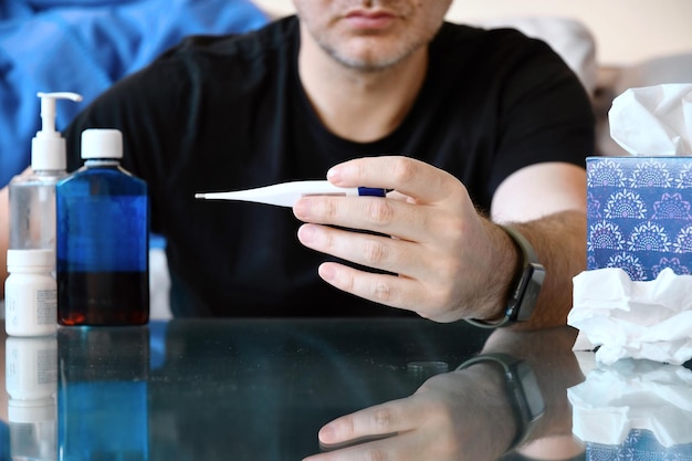 Midsection of man holding drink in restaurant