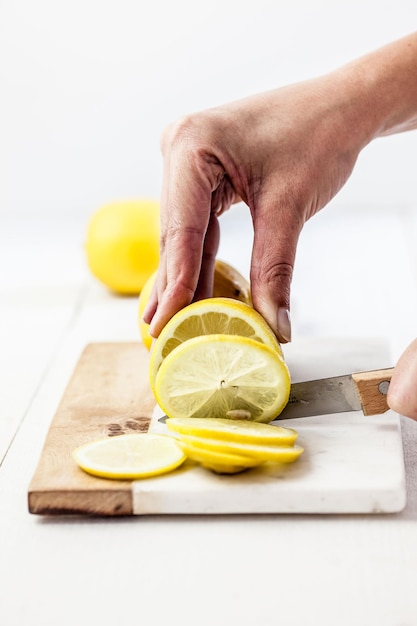 Photo midsection of man holding fruit on table