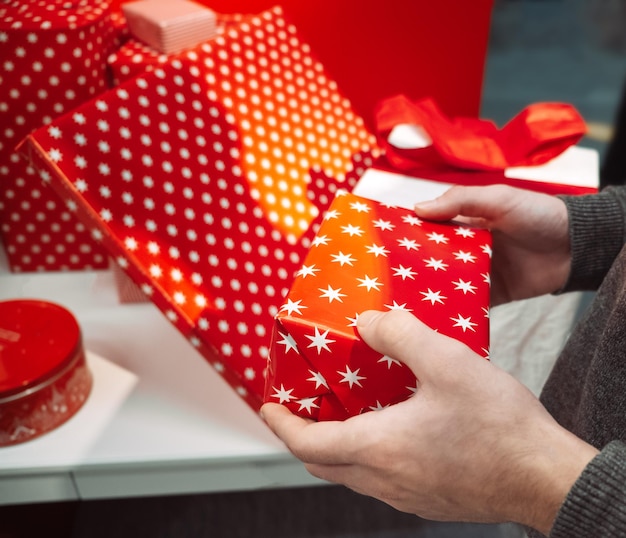 Midsection of man holding gift box