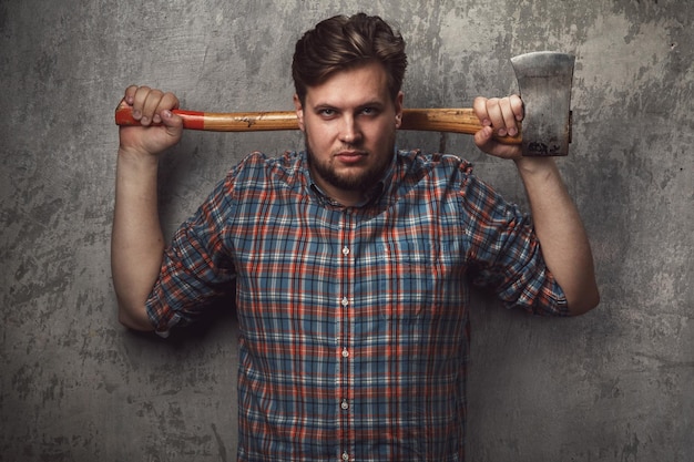 Midsection of man holding hammer