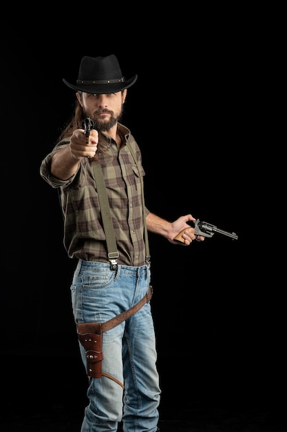 Photo midsection of man holding hat against black background