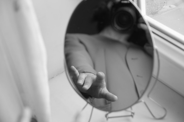 Midsection of man holding mobile phone while sitting in bus