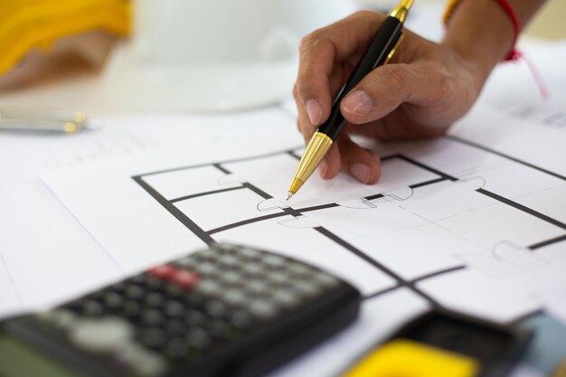 Photo midsection of man holding paper with text on table